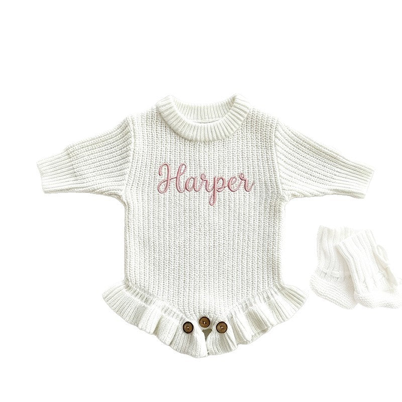 White ruffle knit baby romper embroidered with the name Harper