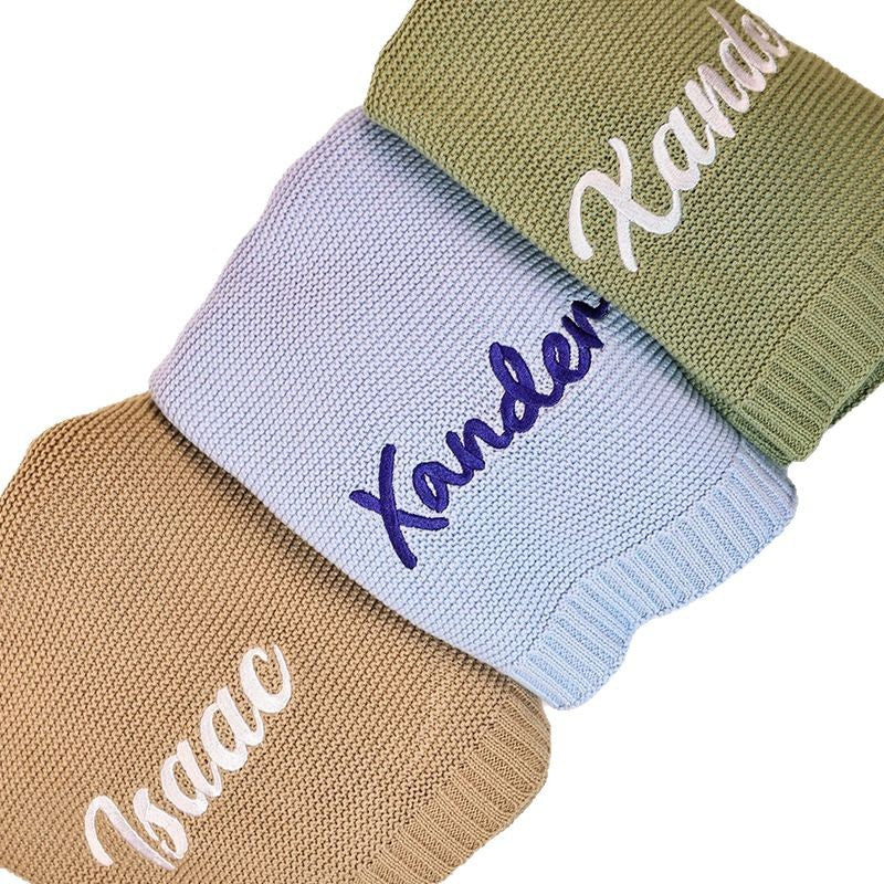 Knit blankets embroidered with Xander and Isaac