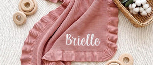 Rose pink ruffle knit blanket embroidered with Brielle