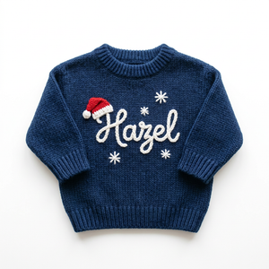 Hand embroidered santa hat & snowflakes Christmas sweater on a plain background