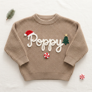 Personalized baby Christmas sweater, hand embroidered santa hat, tree & peppermint, flat lay