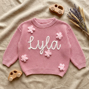 Custom Baby Name Sweater – flat lay