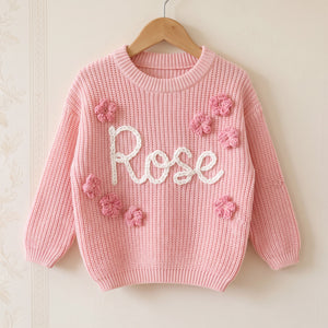 Personalized kids sweater on a wooden hanger