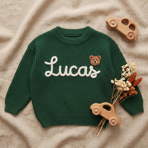 Hand Embroidered Personalized Baby Sweater – flat lay