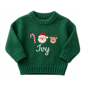 Machine embroidered candy cane, Santa & reindeer baby Christmas sweater on a plain background