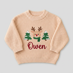 Machine embroidered reindeer & Christmas trees baby Christmas sweater on a plain background