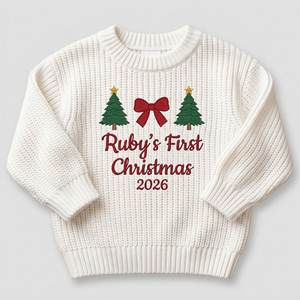 Machine embroidered first Christmas with trees & bow baby Christmas sweater on a plain background
