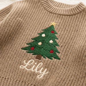 Close-up of machine embroidered big Christmas tree on chunky knit