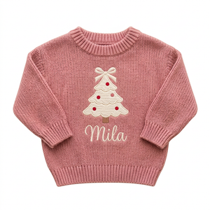 Machine embroidered coquette Christmas tree baby Christmas sweater on a plain background