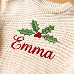 Close-up of machine embroidered holly name on chunky knit