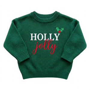 Machine embroidered Holly Jolly baby Christmas sweater on a plain background
