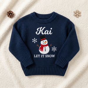 Machine embroidered snowman Let It Snow baby Christmas sweater, flat lay