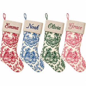 Set of four personalized toile Christmas stockings with natural linen cuff in red, blue, dark green and pink