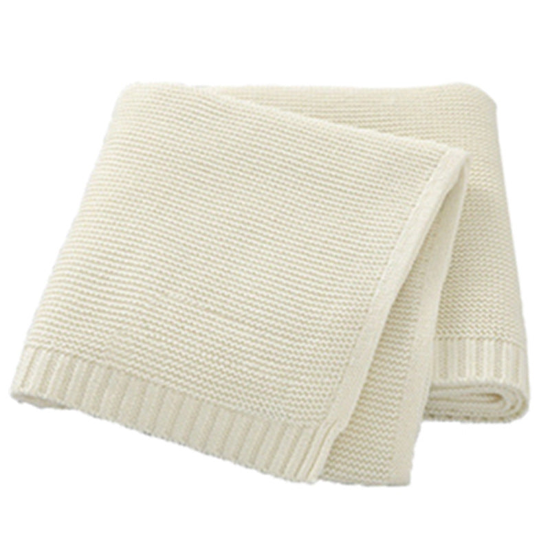 White cotton knit baby blanket with a ribbed border, plain