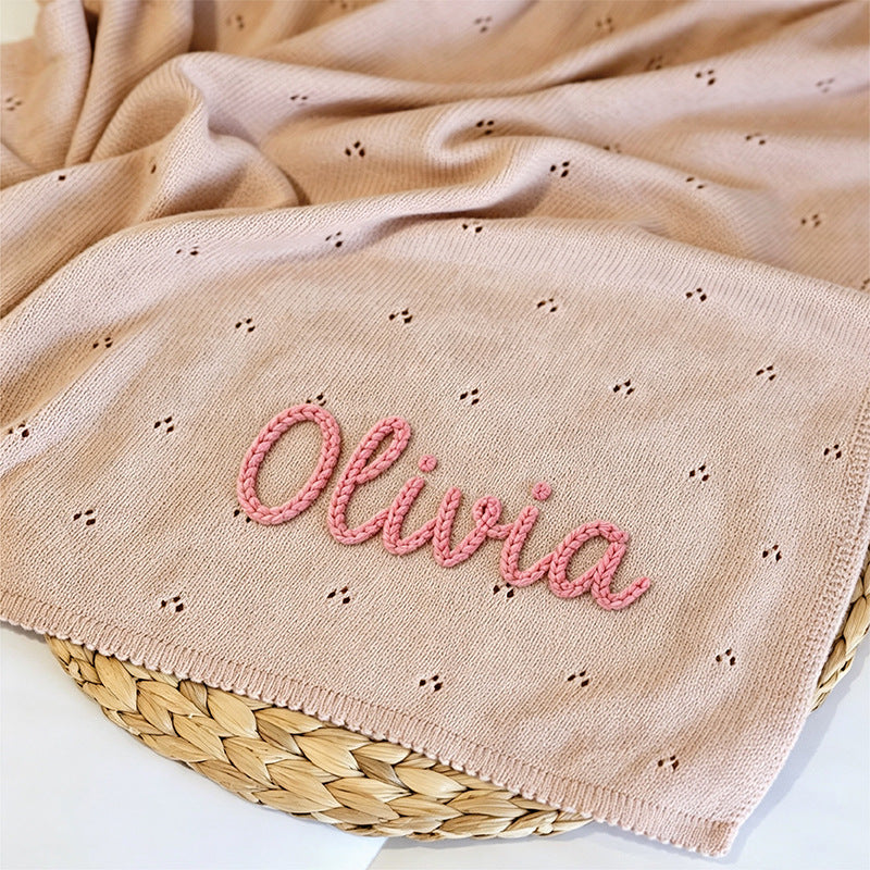 Pointelle knit blanket embroidered with Olivia in pink yarn
