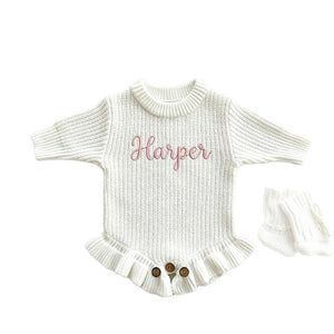 White ruffle knit baby romper embroidered with the name Harper