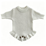 White knit baby romper with ruffle hem