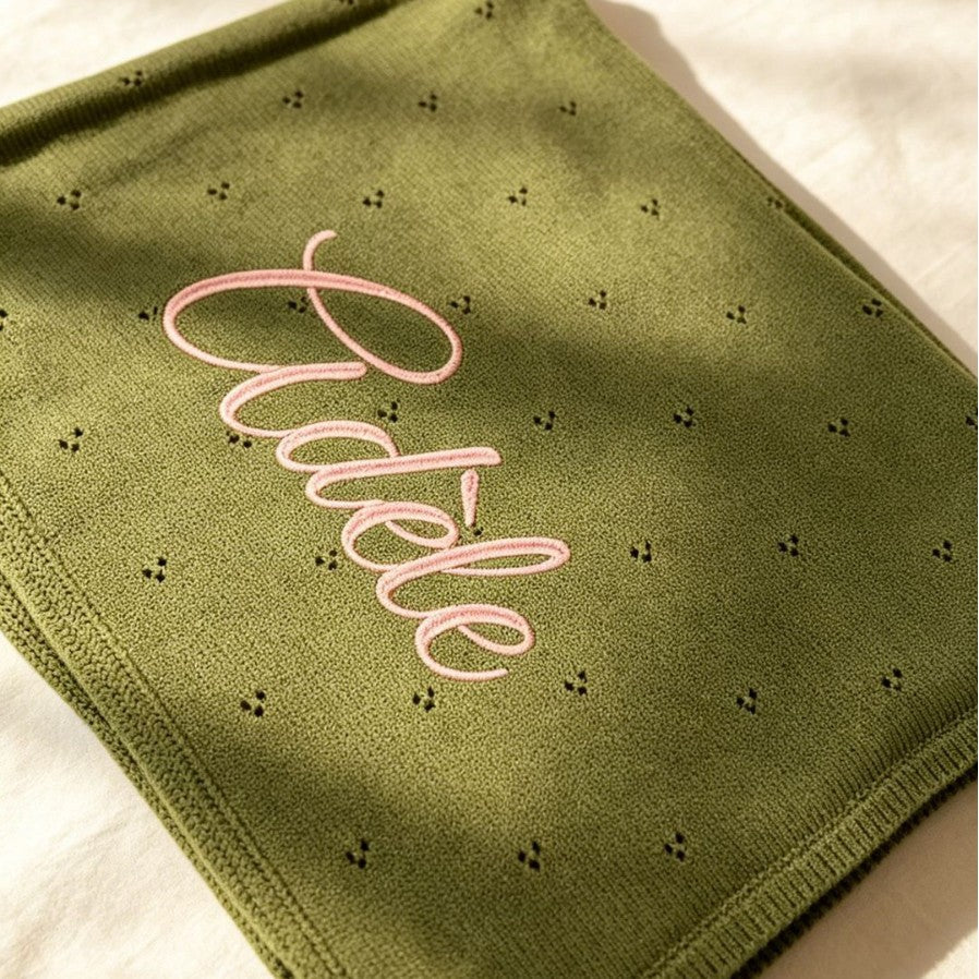 Olive pointelle knit blanket embroidered with Adele in pink script