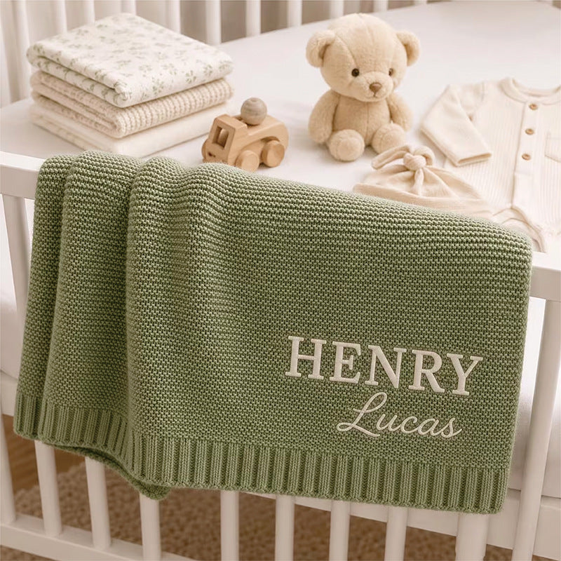 Army green knit baby blanket embroidered with Henry Lucas
