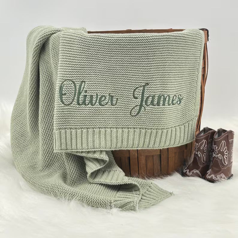 Sage knit baby blanket embroidered with the name Oliver James