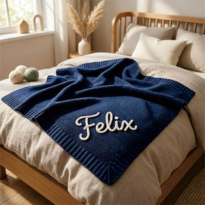 Navy knit baby blanket embroidered with Felix