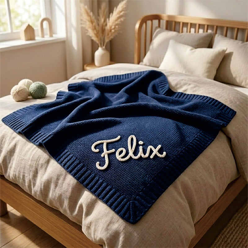 Navy knit baby blanket embroidered with Felix