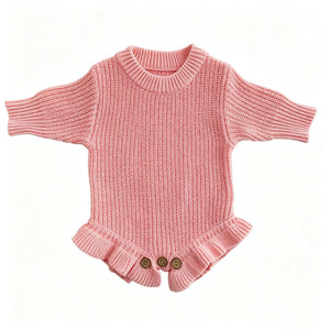 Pink knit baby romper with ruffle hem