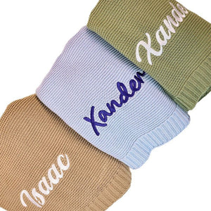 Knit blankets embroidered with Xander and Isaac