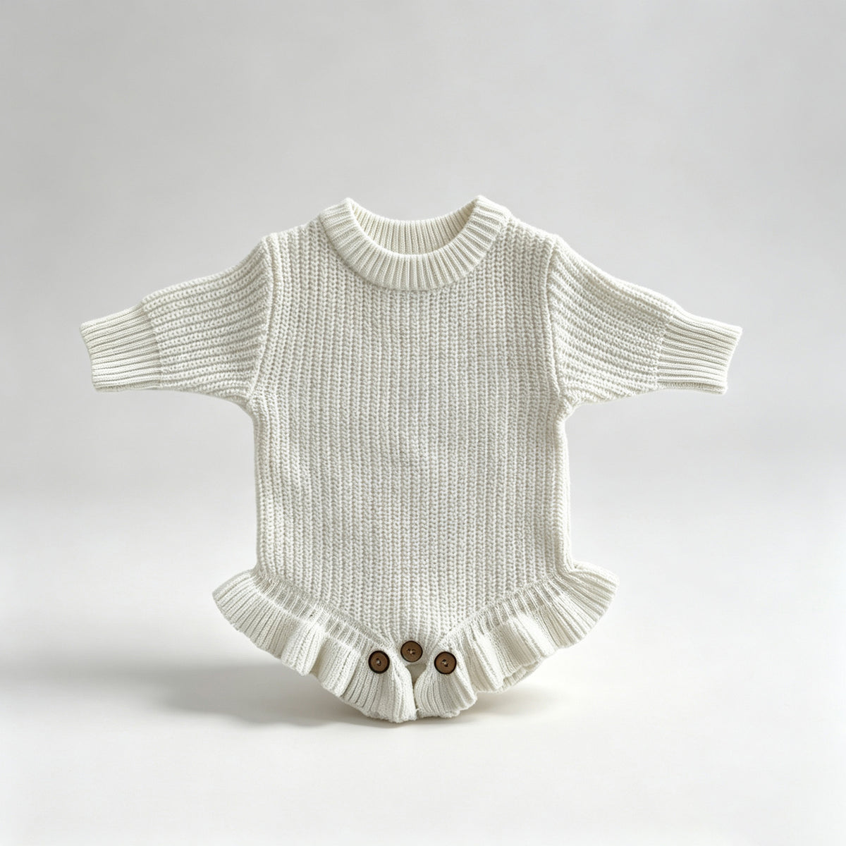 White – Ruffle Hem knit baby romper