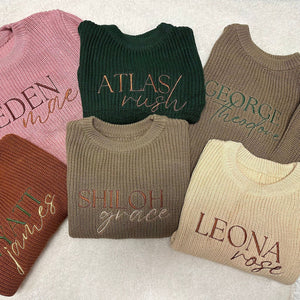 Assorted personalized knit sweaters with embroidered first and middle names