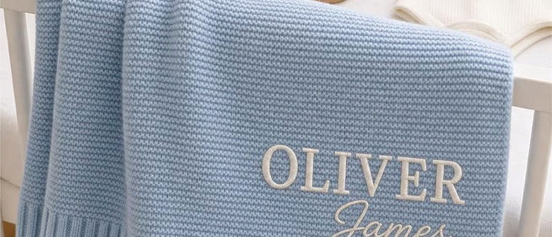 Light blue knit blanket embroidered with Oliver James