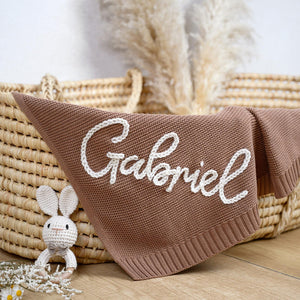 Brown knit blanket embroidered with Gabriel