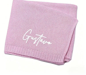 Lavender knit baby blanket embroidered with Gustavo in white