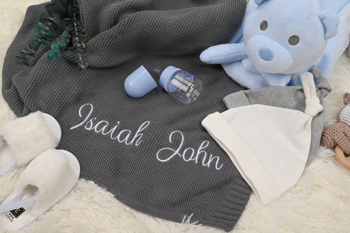Gray knit baby blanket embroidered with Isaiah John
