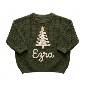 Hand embroidered Christmas tree above name Christmas sweater on a plain background