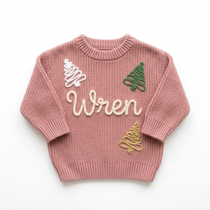 Hand embroidered outline Christmas trees Christmas sweater on a plain background