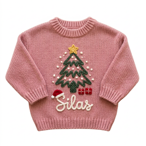 Hand embroidered Christmas tree & santa hat Christmas sweater on a plain background