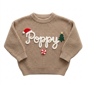 Hand embroidered santa hat, tree & peppermint Christmas sweater on a plain background