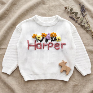 Personalized Toddler Sweater with Hand Embroidered Name – flat lay