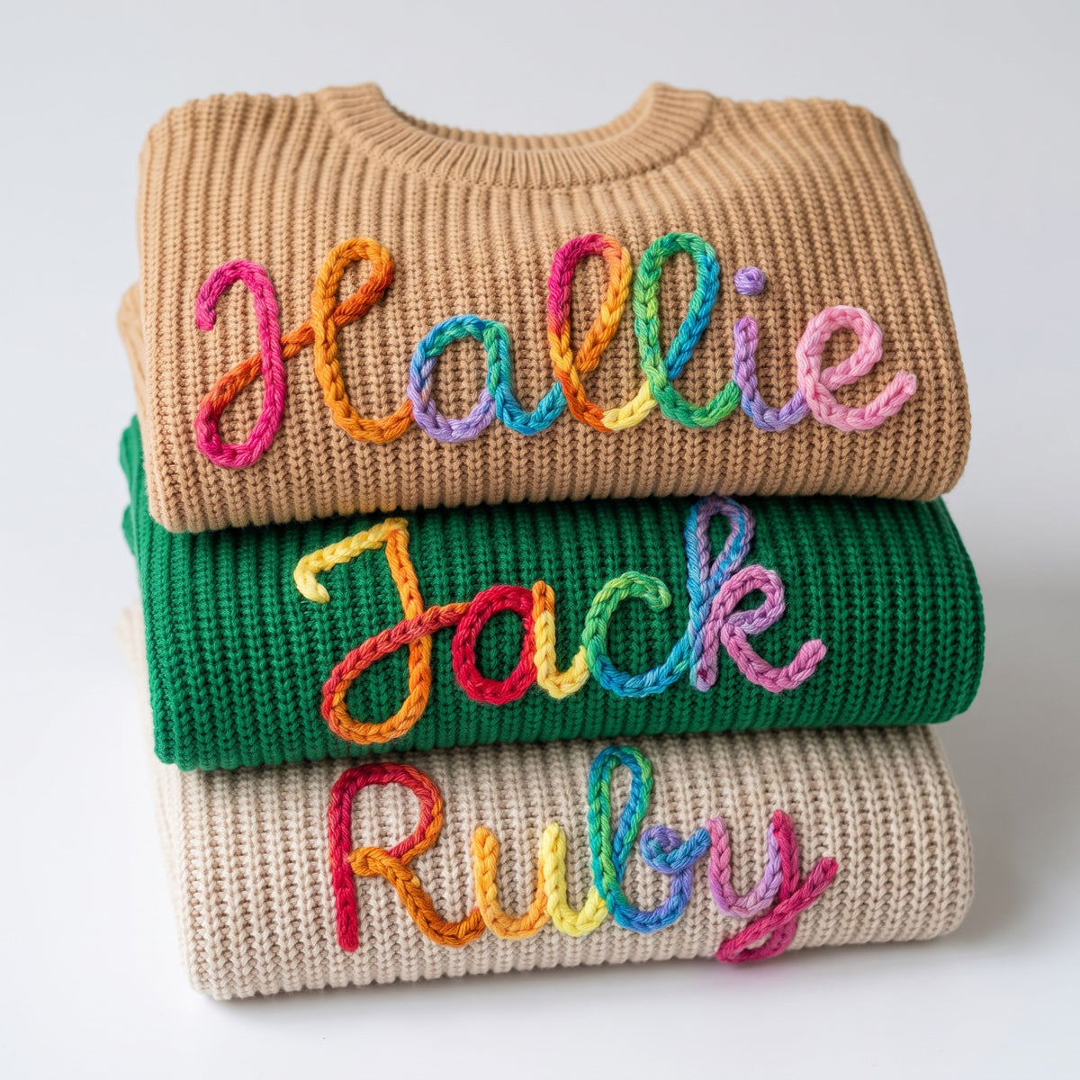 Hand embroidered name sweaters in three knit colors