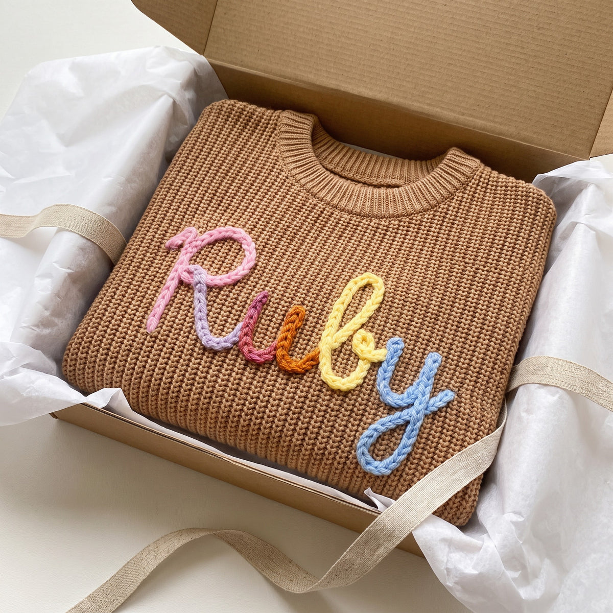 Personalized kids sweater in a gift box