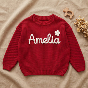 Custom Hand Embroidered Baby Sweater – flat lay