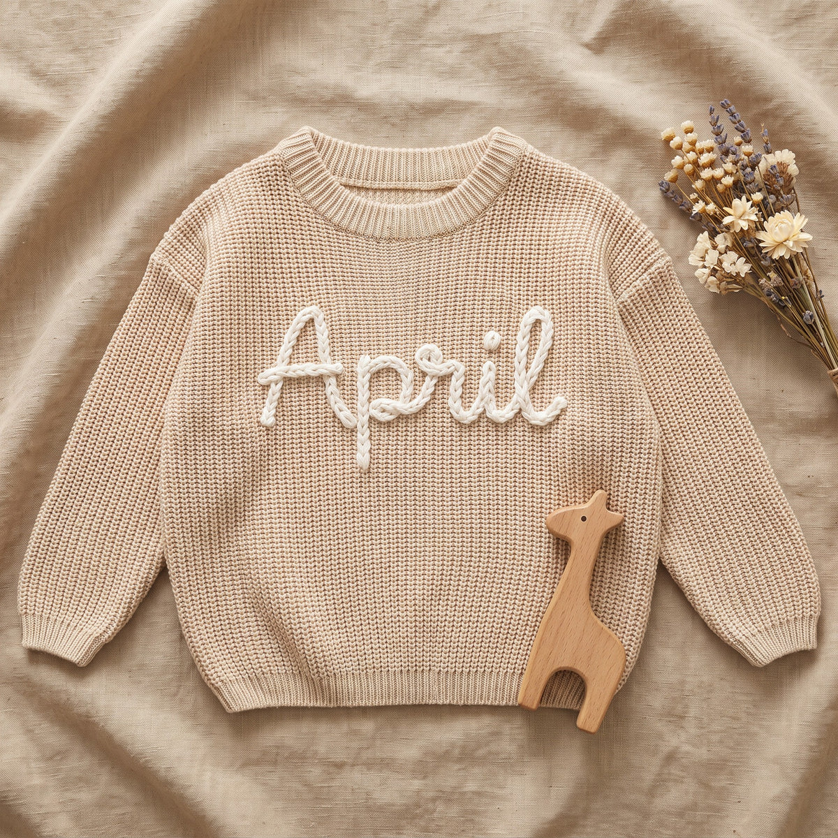 Personalized Newborn & Baby Sweater – flat lay