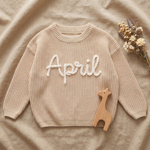 Personalized Newborn & Baby Sweater – flat lay