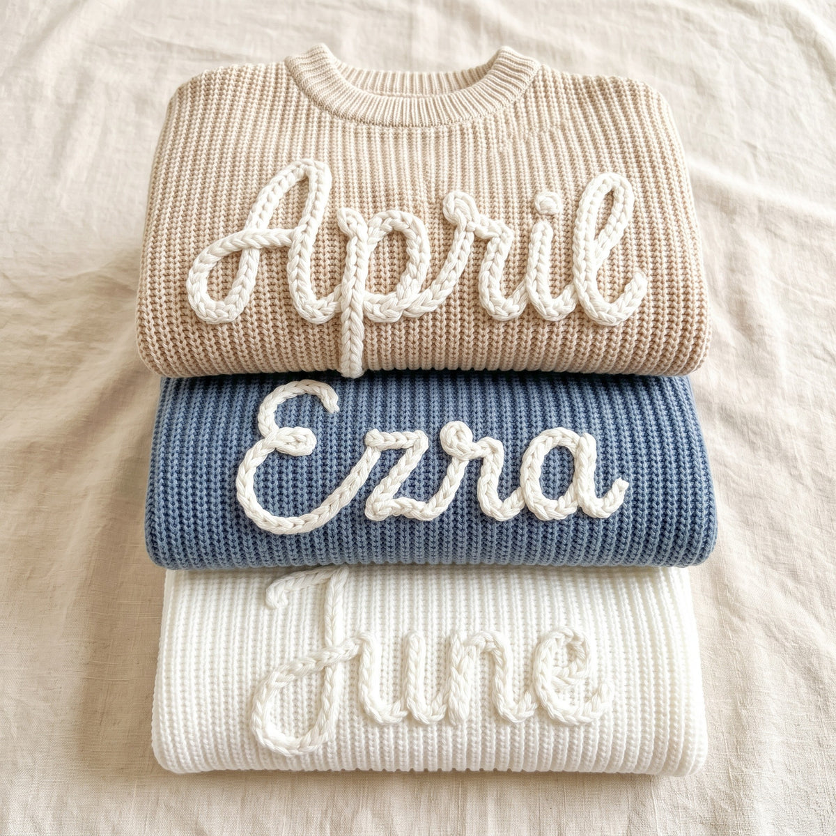 Hand embroidered name sweaters in three knit colors