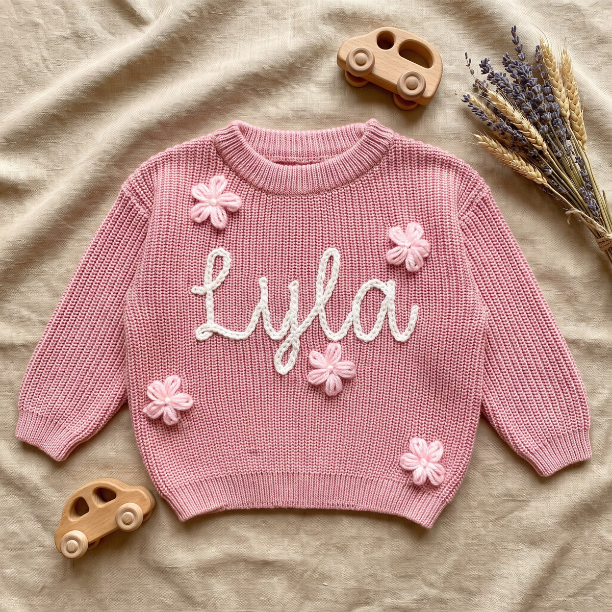 Custom Baby Name Sweater – flat lay