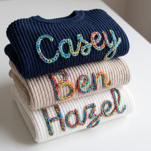 Hand embroidered name sweaters in three knit colors