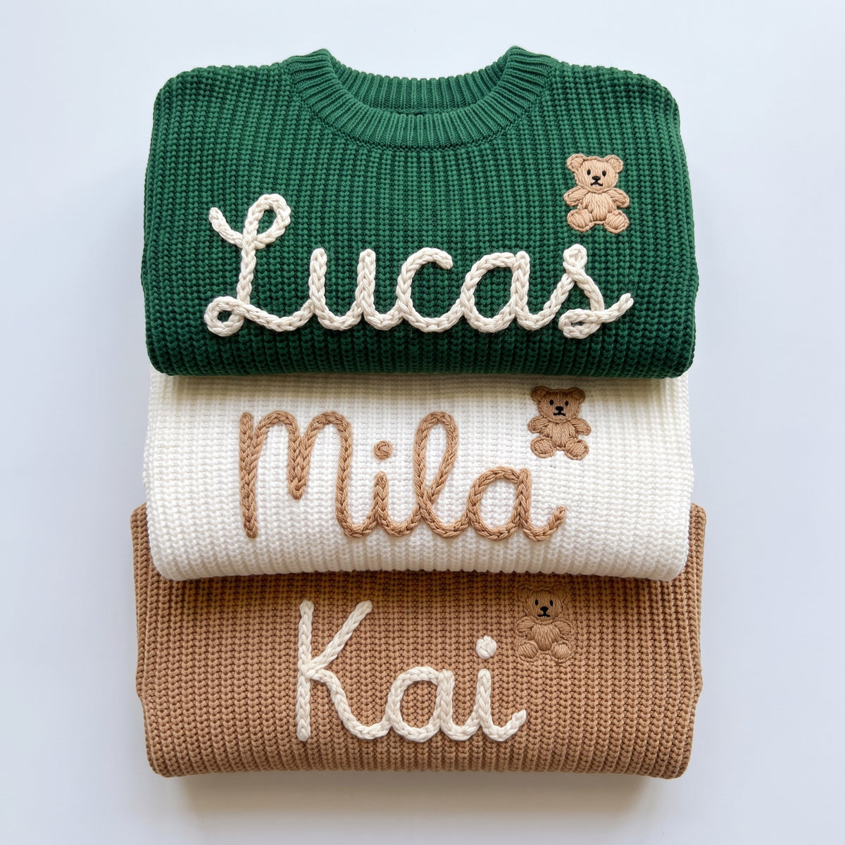 Hand embroidered name sweaters in three knit colors