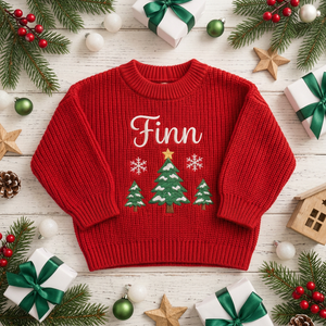 Machine embroidered three snowy Christmas trees baby Christmas sweater among Christmas decorations