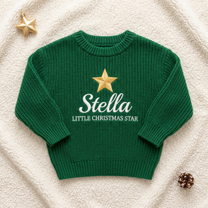 Machine embroidered little Christmas star baby Christmas sweater, flat lay